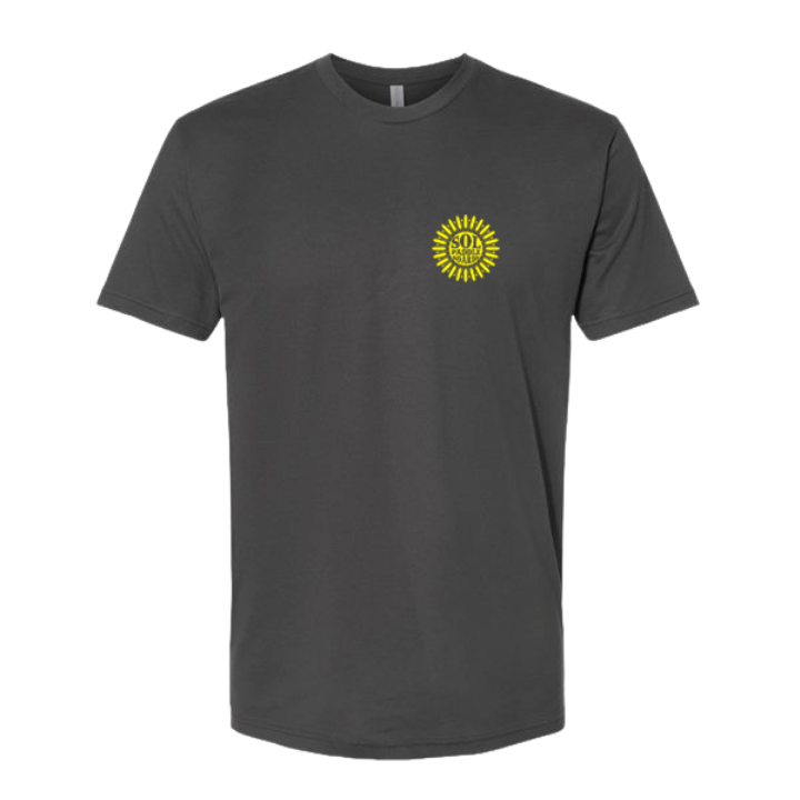 A dark charcoal gray short-sleeve crewneck t-shirt with a small yellow sunburst graphic on the left chest, displayed on a clean white background.