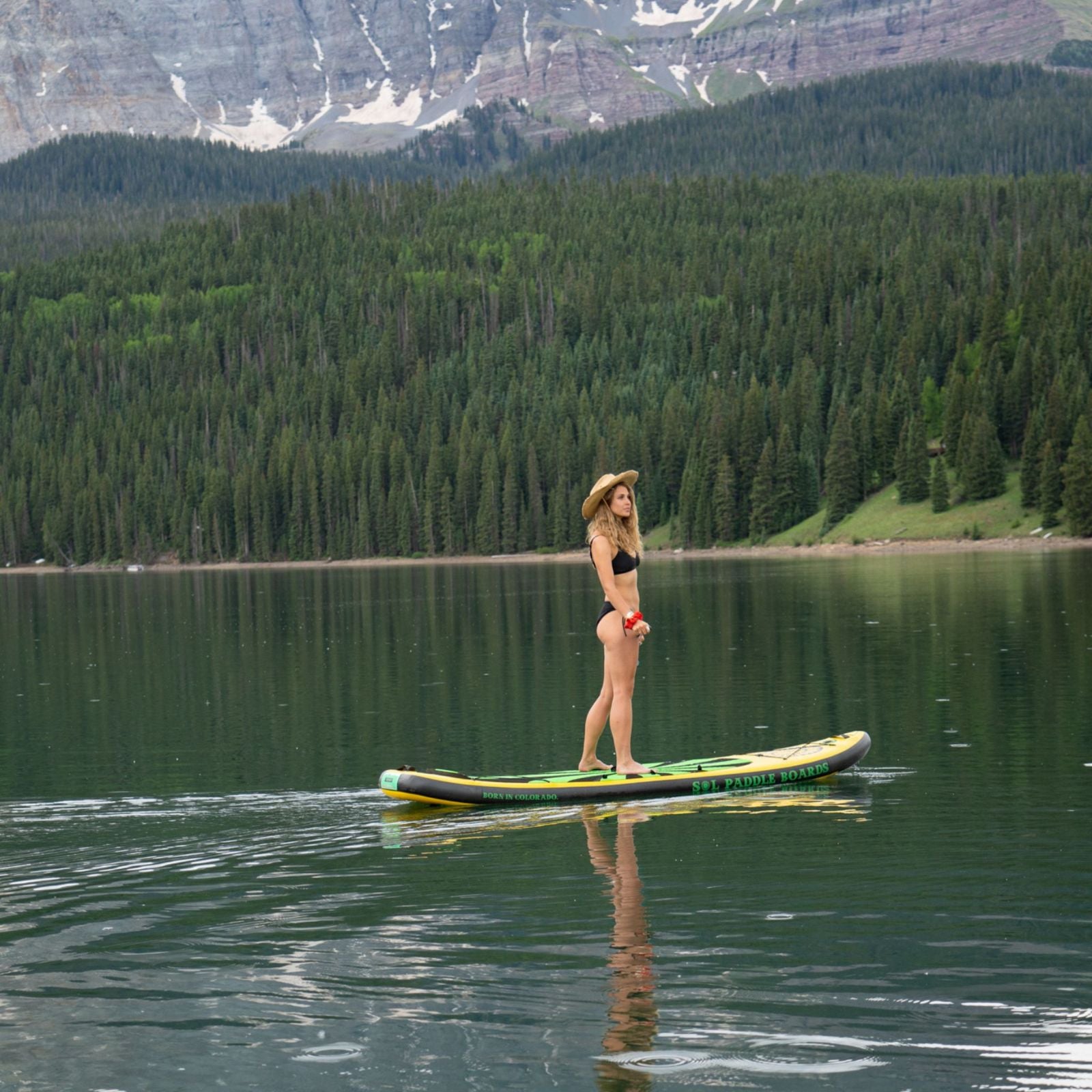 Carbon GalaXy SOLtrain Inflatable Paddle Board Woman Standing on SUP Board in Telluride, Colorado