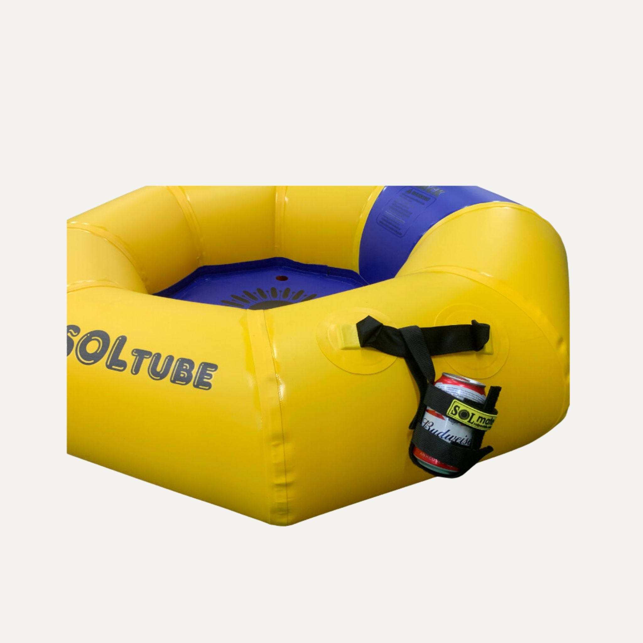 A yellow and blue inflatable SOLtube with an attached SOLmate can holder securely holding a can of Budweiser. The holder is fastened to the tube handle with adjustable straps, showcasing its convenience for keeping beverages within reach.