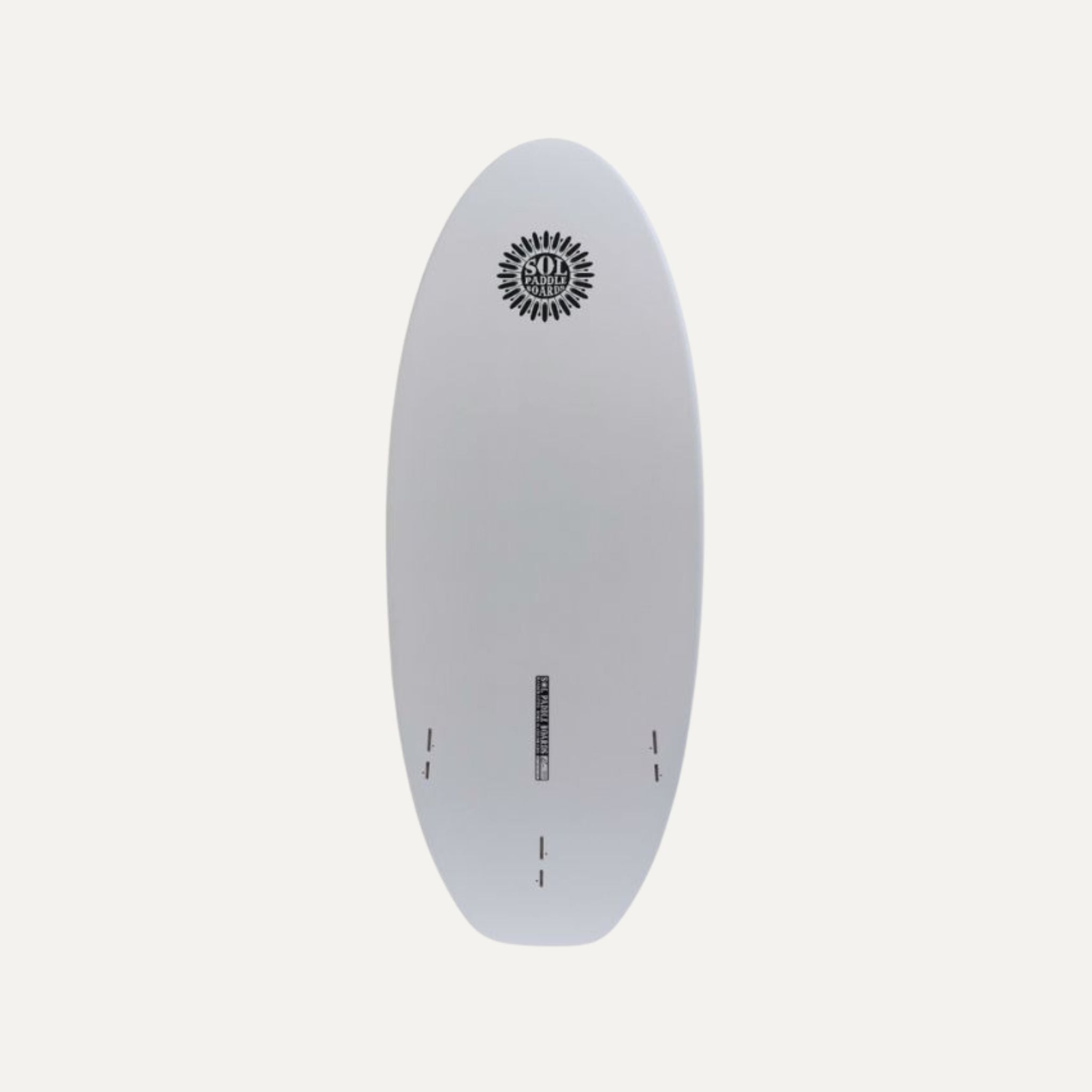Bottom view of the SOL Paddle Boards' SOLscepterXL Epoxy Prone River Surfboard, showcasing a smooth, white surface with a black SOL Paddle Boards logo near the top. The board features multiple fin slots near the bottom and a central slot for additional accessories or attachments.