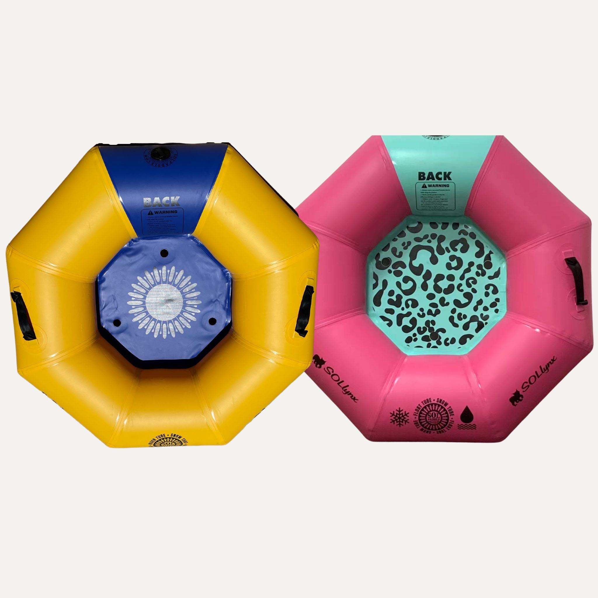 Two SOLtube inflatables side by side, one in yellow and blue, the other in pink and teal, viewed from the top.